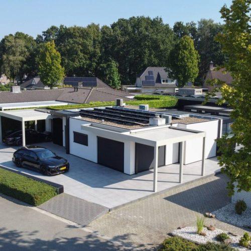 A bungalow with two carports, photographed from above
