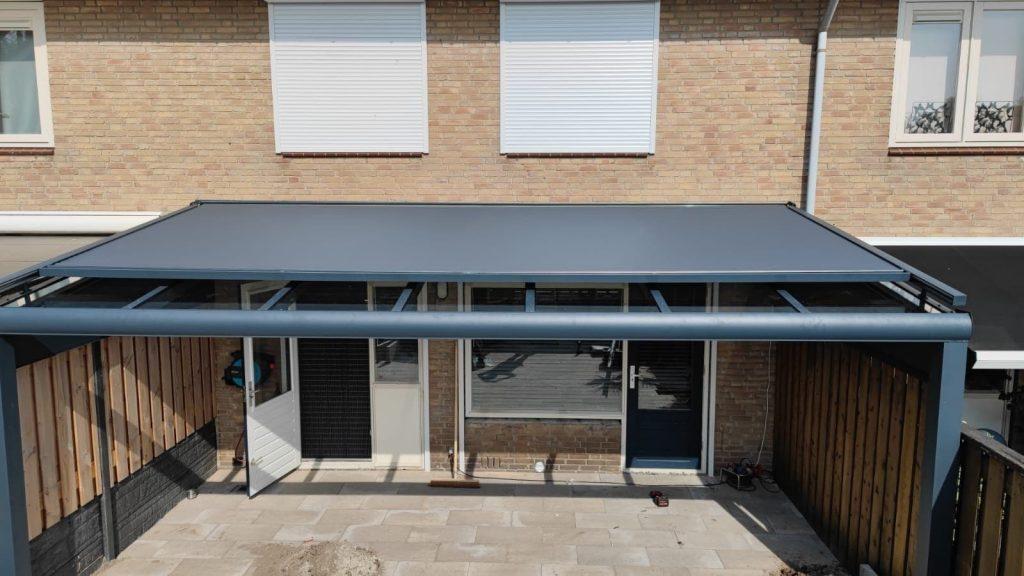 Electric awnings on the roof of a veranda