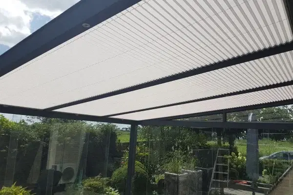 Pleated blinds on the glass roof of a canopy