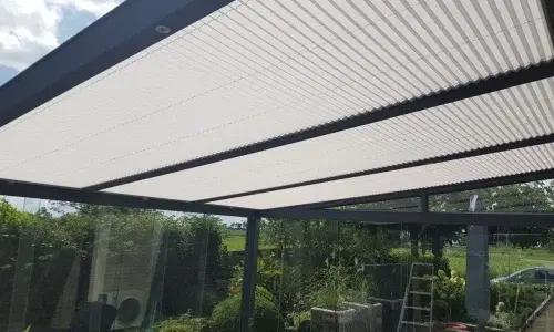 Pleated blinds on the glass roof of a canopy